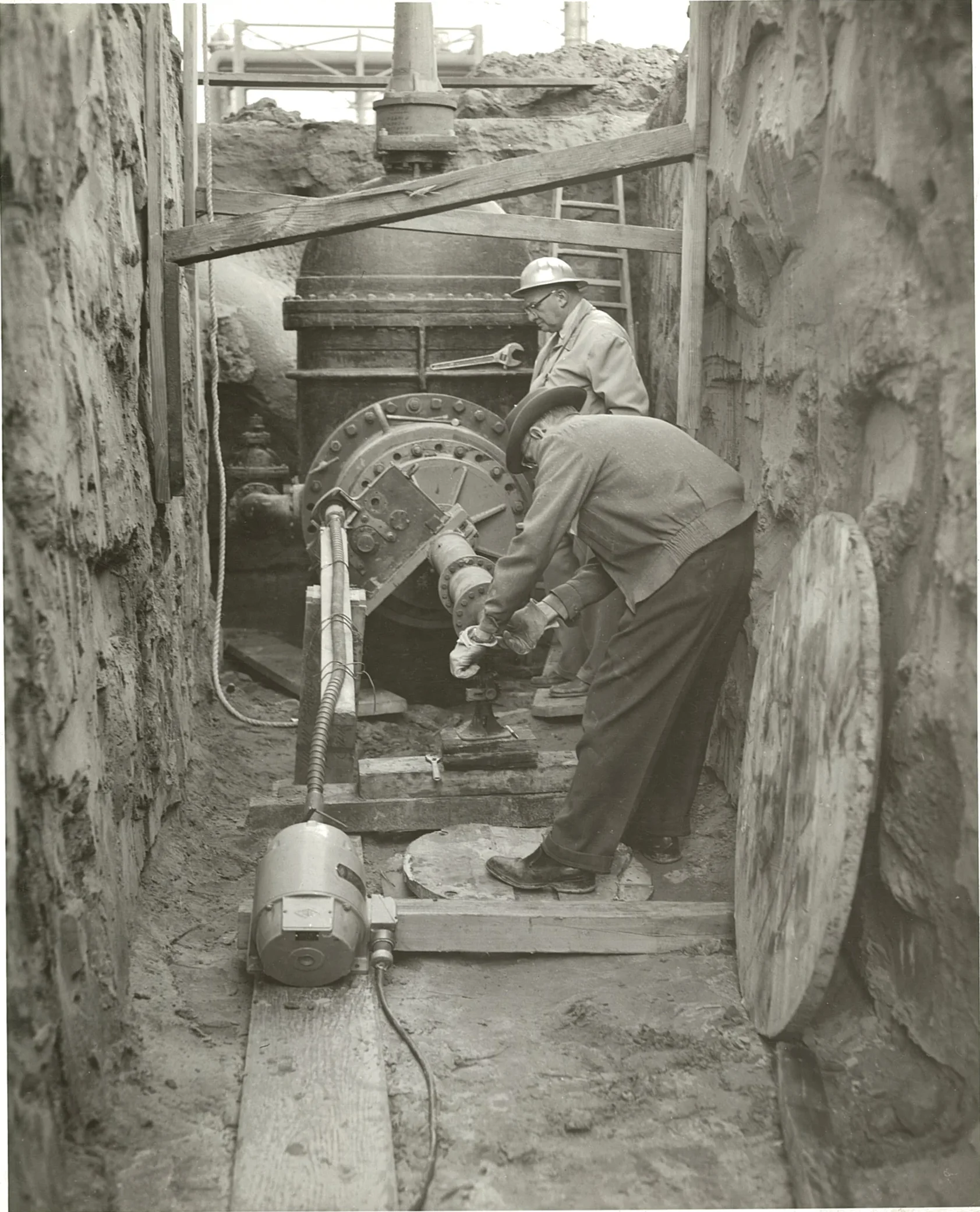 Mr. Koppl and a fellow worker operating historic hot tap equipment